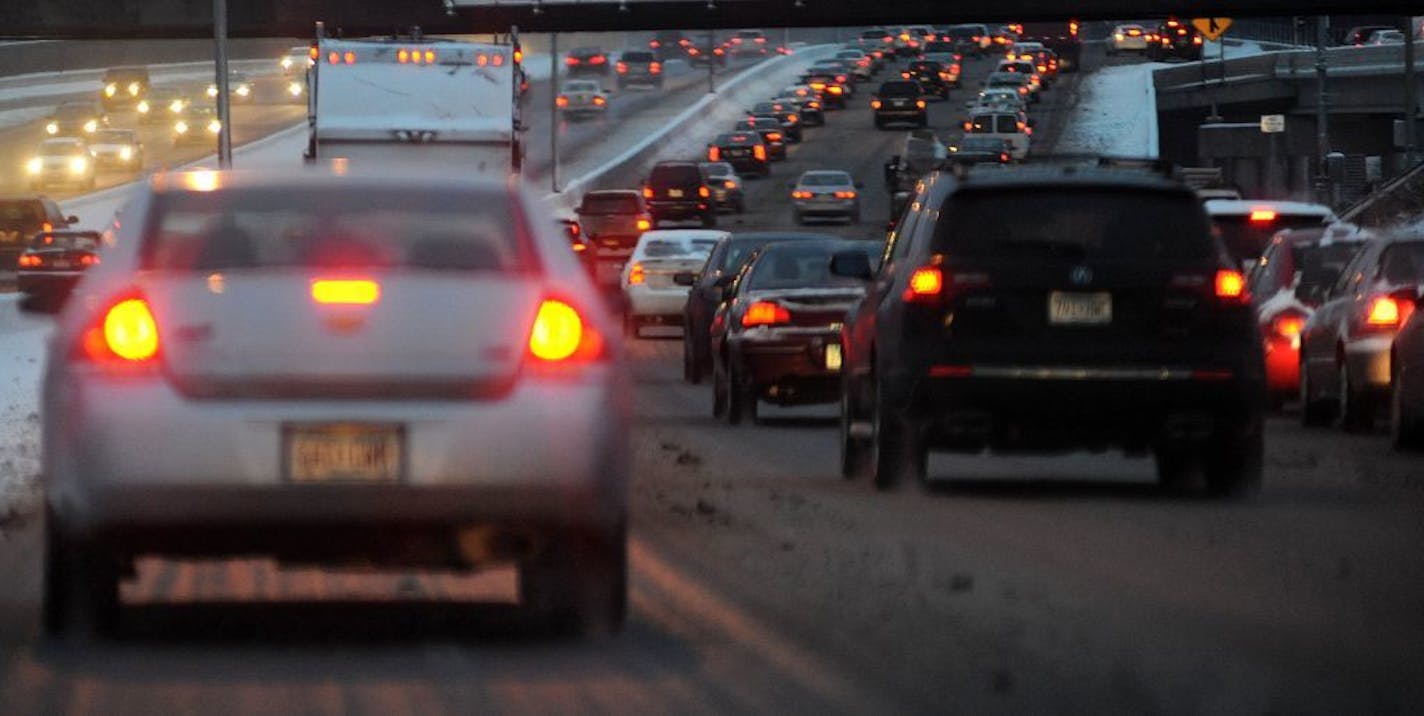 I-394 was a sea of red brake lights around dawn Tuesday because of the snowy conditions.