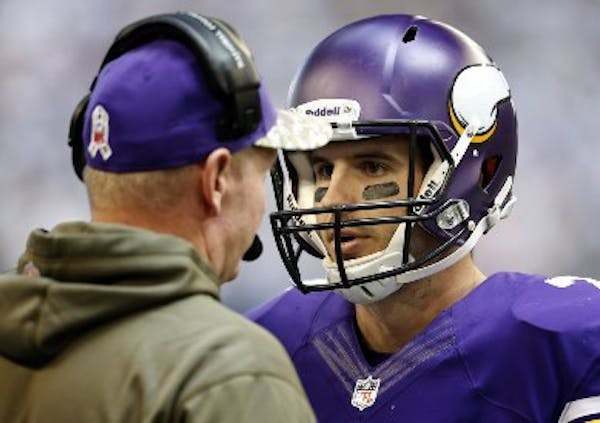 Former Vikings quarterback Christian Ponder, right, and offensive coordinator Bill Musgrave are now with Oakland and return to Minneapolis on Saturday