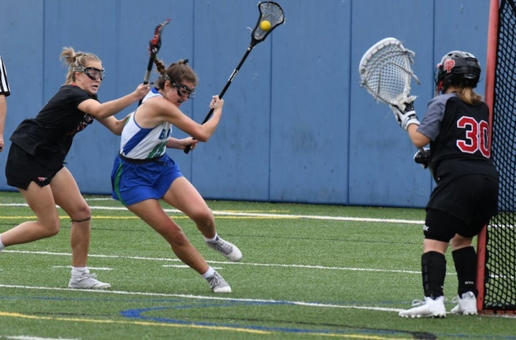 Blake attacker Erin Lee works her way to the goal in a 15-10 lacrosse victory over Eden Prairie on May 22.