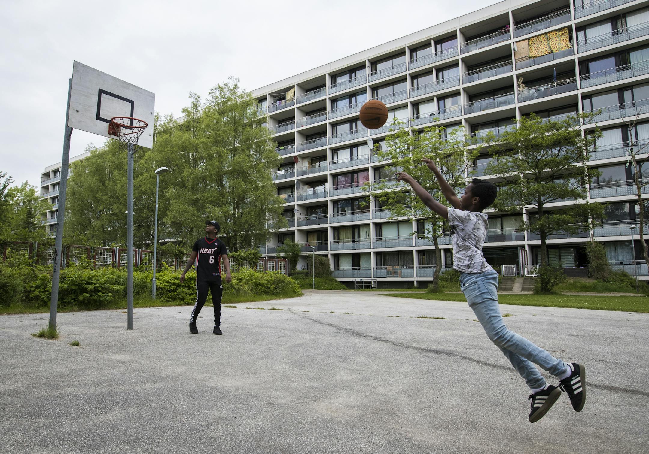 CASE STUDY: Two boys played in the Gellerupparken neighborhood, the nation&#x2019;s lowest-income postal code. It has been a focus of outreach and prevention efforts.