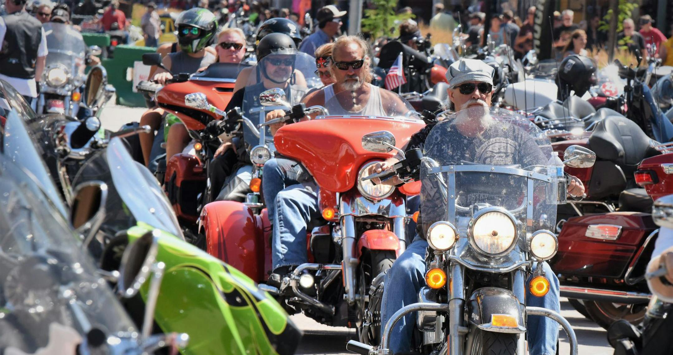 This Aug. 2, 2019 photo shows Heavy traffic on legendary Main Street in Sturgis, S.D., South Dakota, which has seen an uptick in coronavirus infections in recent weeks, is bracing to host hundreds of thousands of bikers for the 80th edition of the Sturgis Motorcycle Rally. More than 250,000 people are expected to attend the Aug. 7 to Aug. 16 rally in western South Dakota. (Jim Holland/Rapid City Journal via AP)