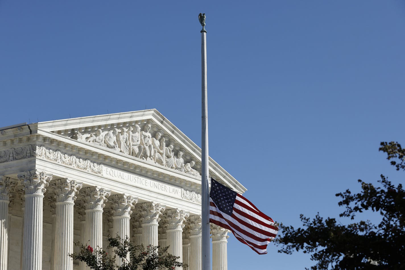 The American flag flies at half staff in memory of late Associate Justice Ruth Bader Ginsburg outside the Supreme Court in Washington, D.C. on Sept. 21, 2020. (Yuri Gripas/Abaca Press/TNS) ORG XMIT: 1776036