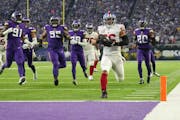 New York Giants running back Saquon Barkley (26) scores a touchdown in the first quarter of an NFL wild card playoff game between the Minnesota Viking