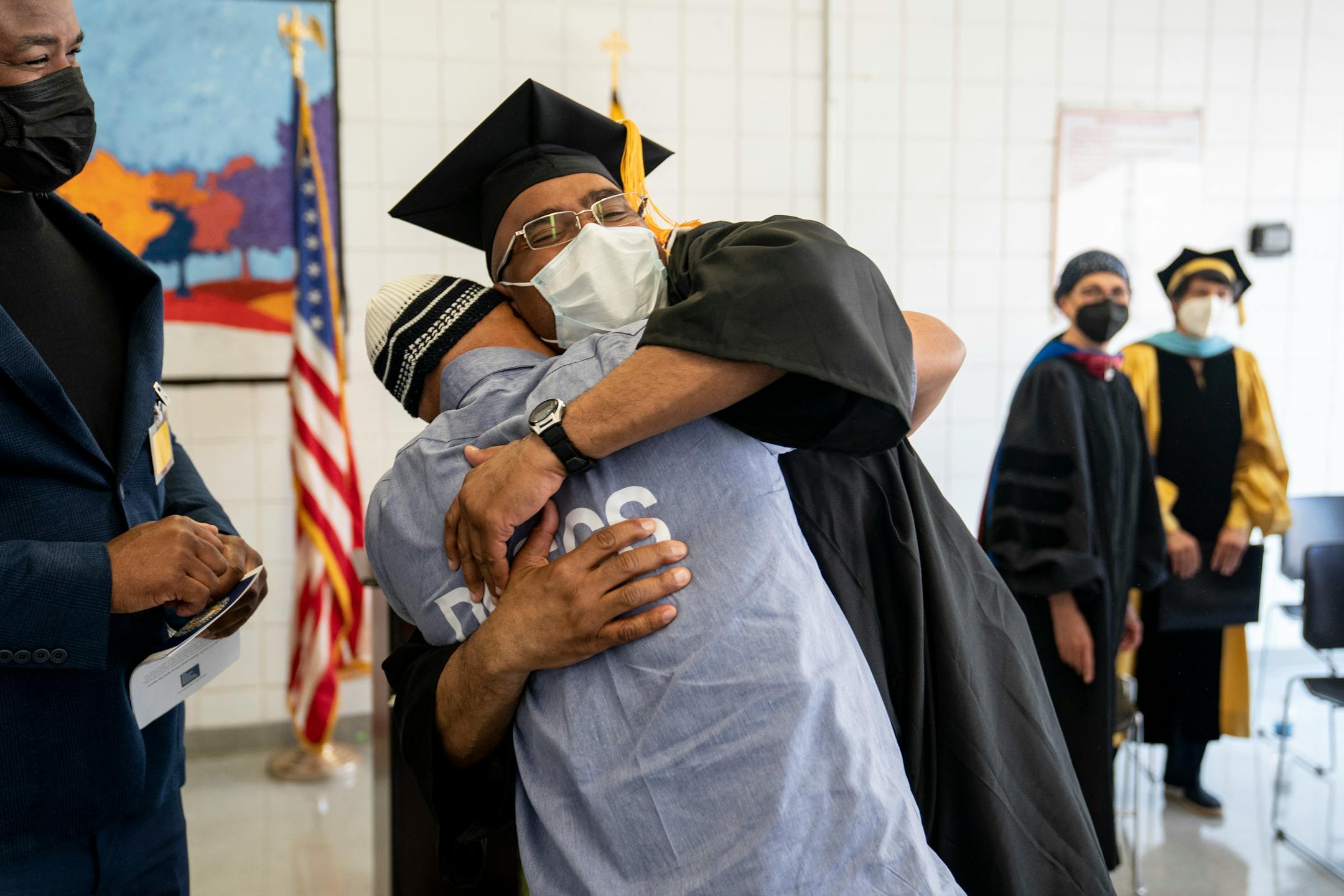 Walter L. McCoy Jr. hugs a student in the Goucher Prison Education Partnership after the Goucher College graduation ceremony at the Maryland Correctional Institution-Jessup on May 18. MUST CREDIT: Washington Post photo by Carolyn Van Houten.