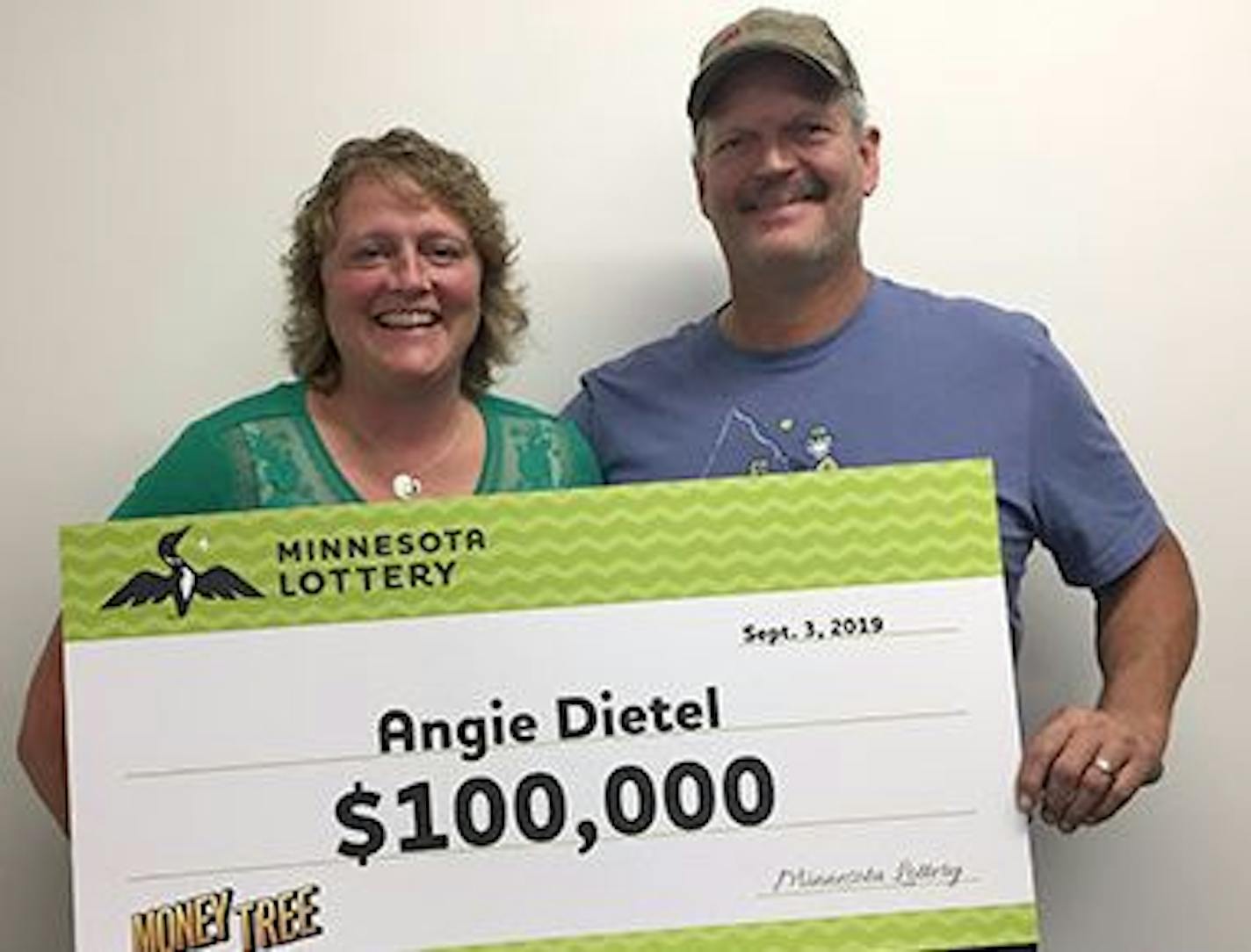 Angie Dietel claimed her prize Tuesday at State Lottery headquarters in Roseville, with husband David at her side. Credit: Minnesota Lottery