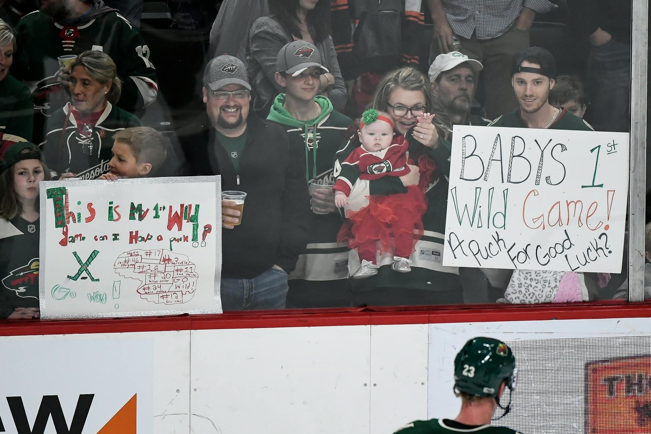 Young fans vied for the attention of Wild players for the chance of getting tossed a puck before the start of Saturday night's Wild game against the Columbus Blue Jackets.