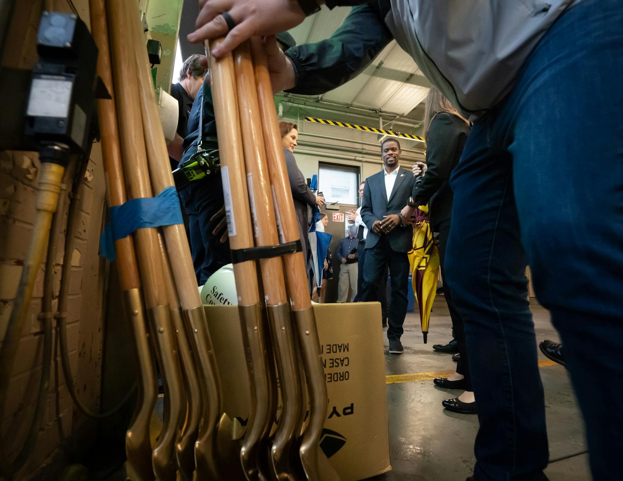 Deputy Mayor Jamie Tincher and St. Paul Mayor Melvin Carter, center waited for the golden shovels to be distributed for the groundbreaking ceremony.