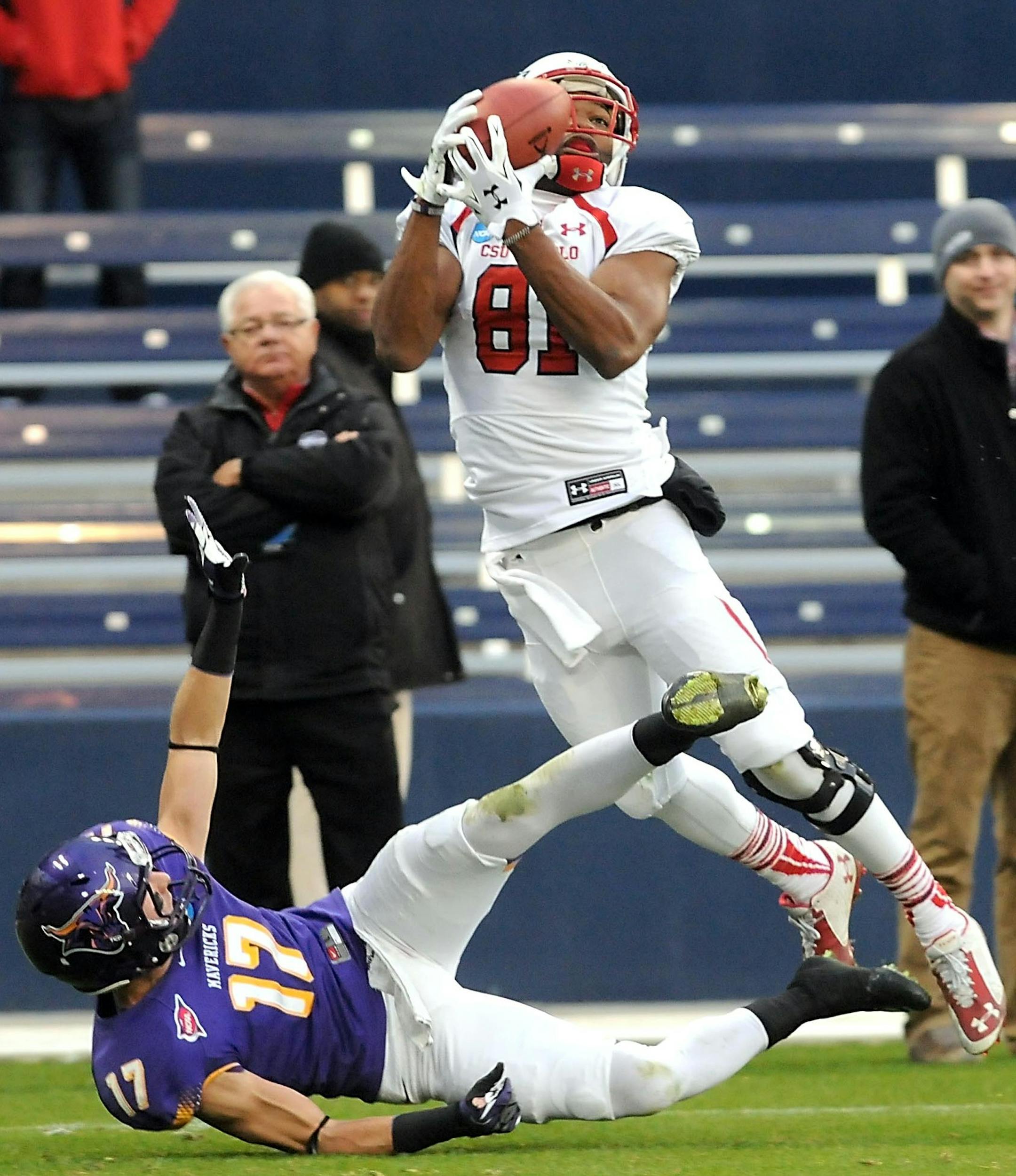 Minnesota State's Justin Otto (17) falls as Colorado State-Pueblo's Paul Browning (81) makes a catch for a touchdown during the first half of the NCAA Division II national championship game Saturday at Sporting Park in Kansas City. Photo by Pat Christman