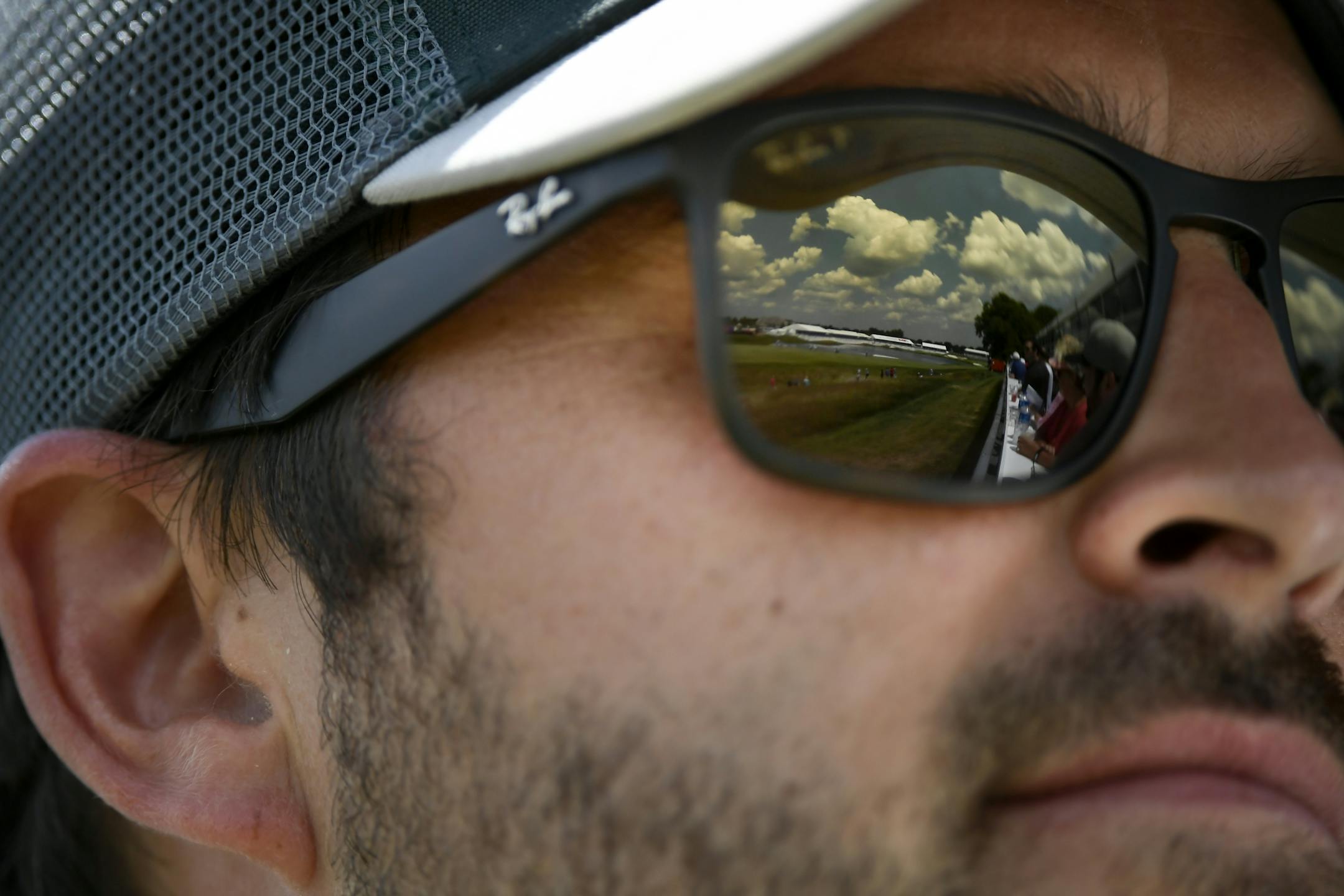 Luke Siewert, of Apple Valley, watched 18th hole action from the Champions Club Saturday.