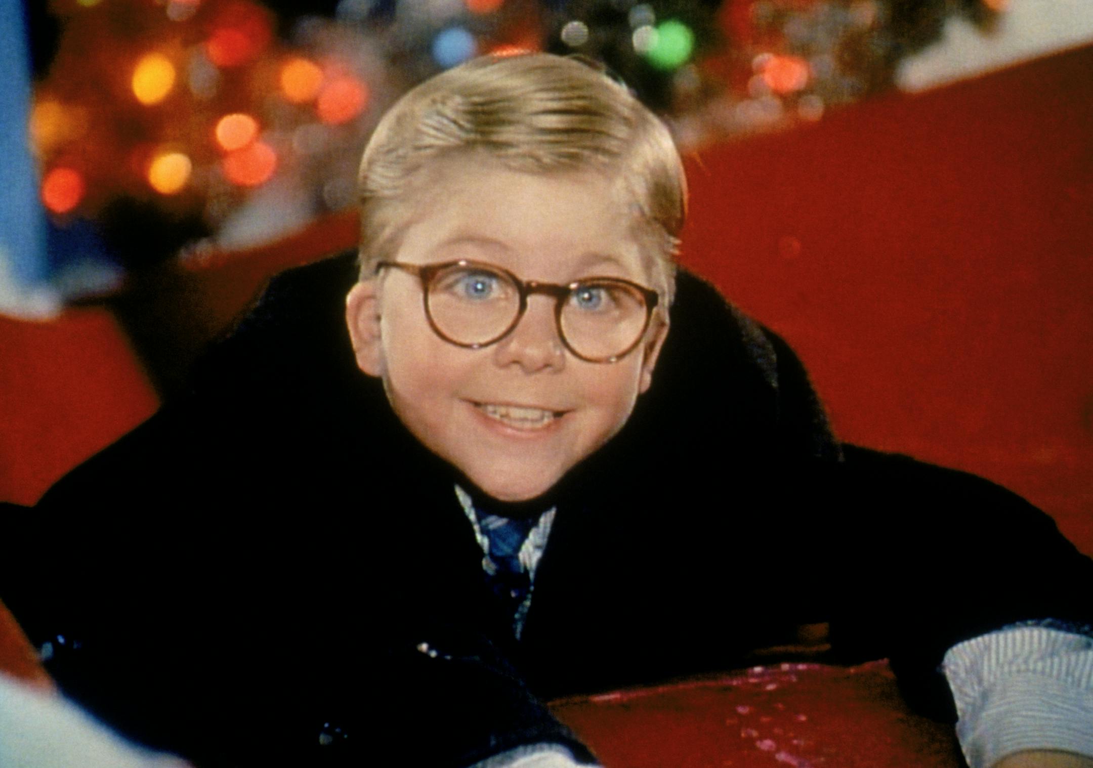 In a still from the movie "A Christmas Story," Ralphie (played by Peter Billingsley) hops on a slide just after visiting Santa Claus in Higbee's Department Store ] Credit: Turner Entertainment