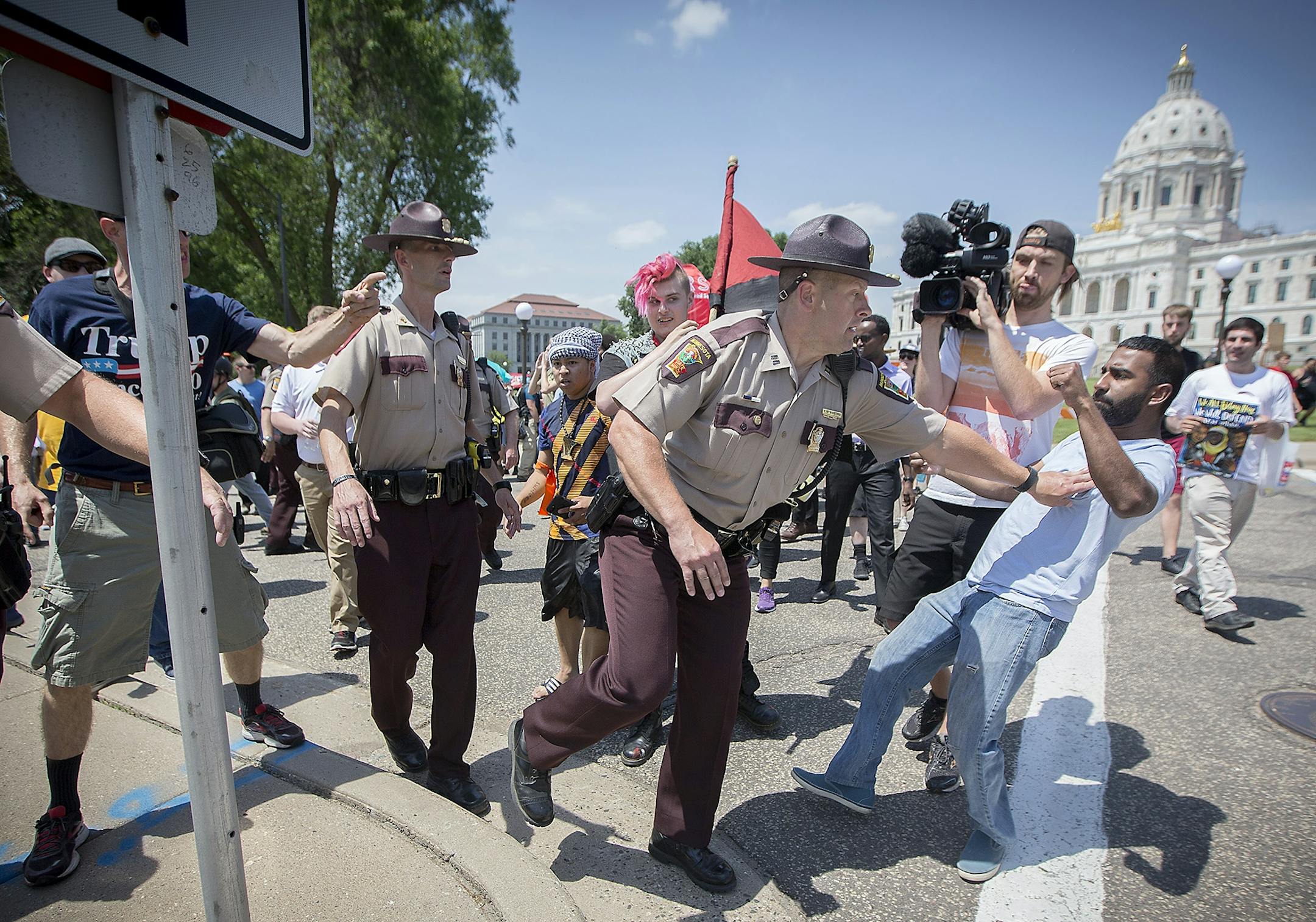 An anti-Sharia law group and antifascist protesters clashed during dueling rallies at the Minnesota State Capitol, Saturday, June 10, 2017 in St. Paul, MN. When a small faction of the anti-sharia group challenged the protesters outside, the Minnesota State Patrol had to intervene.