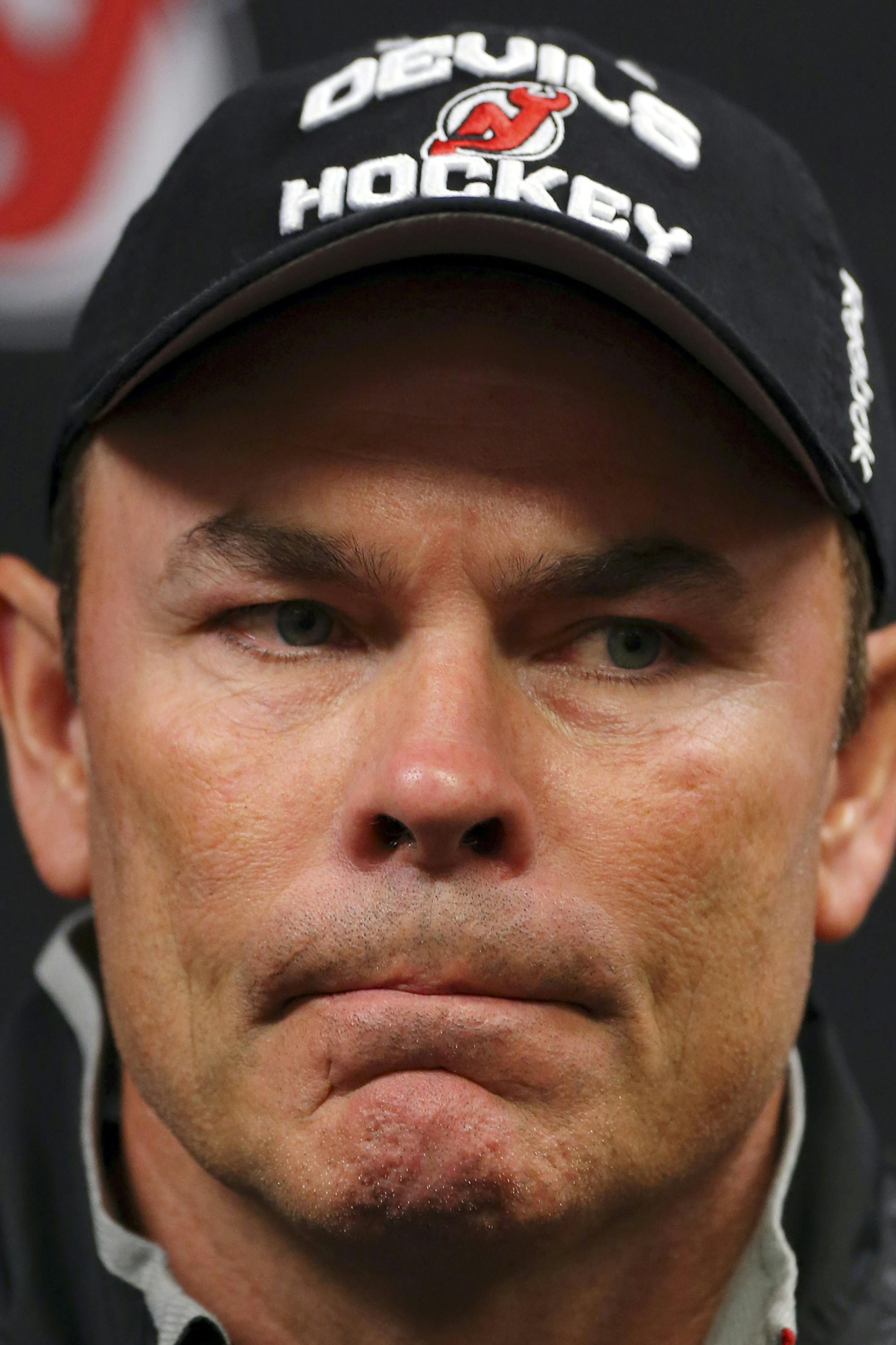 New Jersey Devils coach Adam Oates speaks during an NHL hockey news conference, Saturday, Dec. 27, 2014, in Newark, N.J. Devils are replacing the fired Pete DeBoer with a three-headed coaching staff. Former Washington Capitals coach Oates, ex-Devils assistant and star defenseman Scott Stevens and general manager Lou Lamoriello will split duties on the bench.(AP Photo/Adam Hunger)