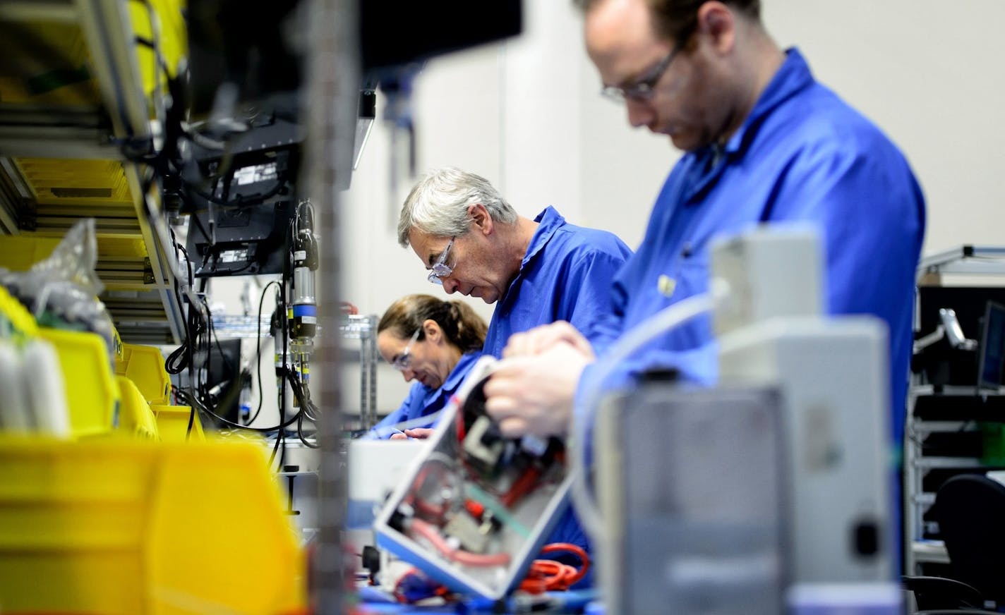 Smiths Medical employees Mary Prihoda, Charlie Arnold and Brad Davis assembled Level 1Hotline Fluid Warmer devices at the company's Oakdale, MN plant. ] GLEN STUBBE * gstubbe@startribune.com Monday September 21, 2015 Smiths Medical, Oakdale, MN ORG XMIT: MIN1509211341390097