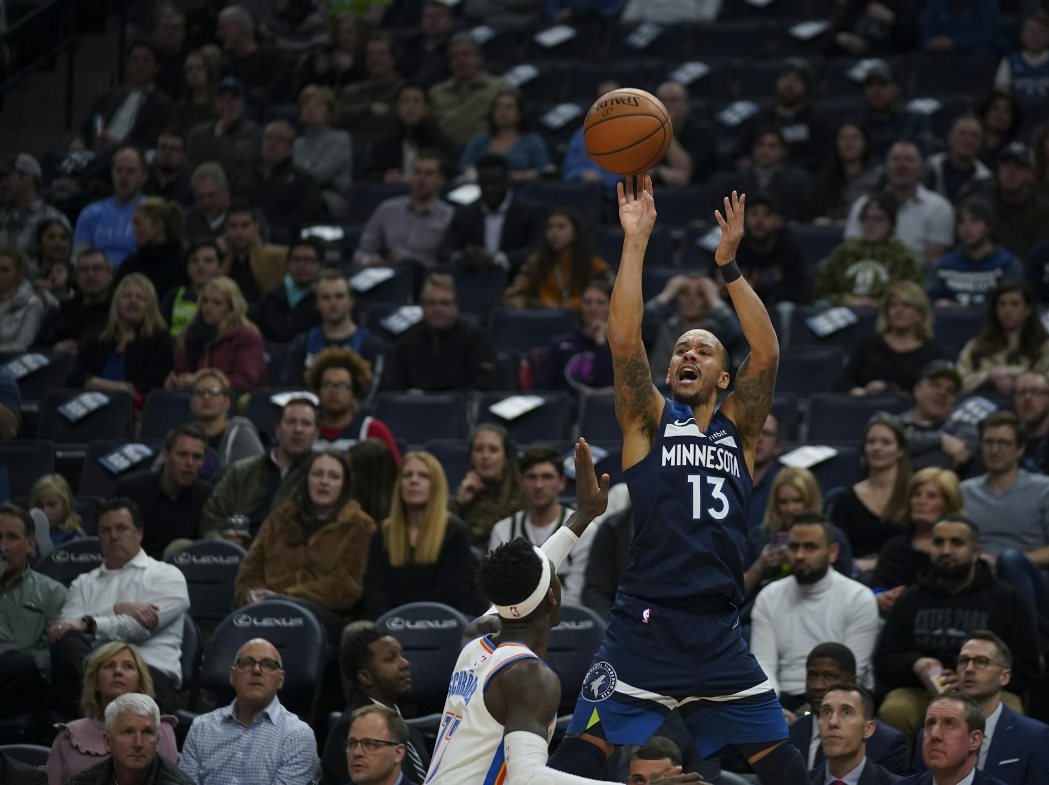 Minnesota Timberwolves guard Shabazz Napier (13) was fouled shooting a three pointer by Oklahoma City Thunder guard Dennis Schroder (17) in the first half.