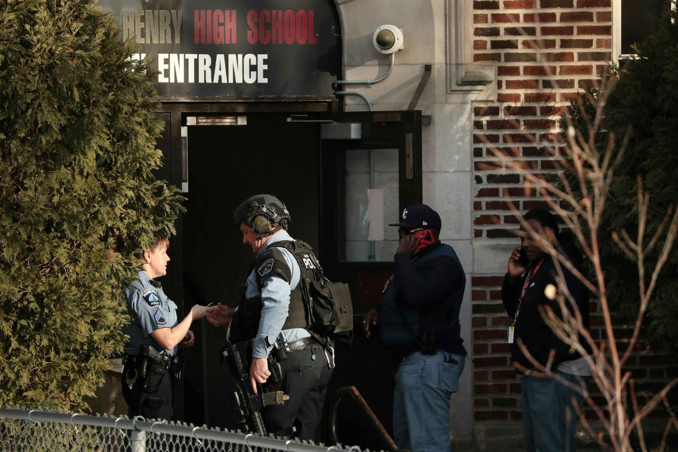 Police in tactical gear entered Patrick Henry High School after a gunman was reported getting off a Metro Transit bus near the school Tuesday.