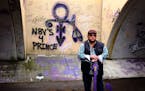 Nick Garcia, of San Angelo, Texas, stood for a portrait in the Graffit tunnel outside of Prince's Paisley Park on Thursday, April 20, 2017. He was hol