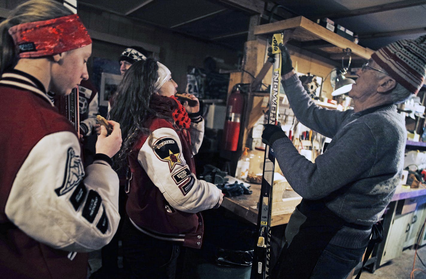 In the ski wax house at Bob Hagstrom's property in Grant Township, Anya Nelson,15, and Morgan McBride enjoyed some cookies provided by Hagstrom,84, who was a volunteer coach for olympian Jessie Diggins.