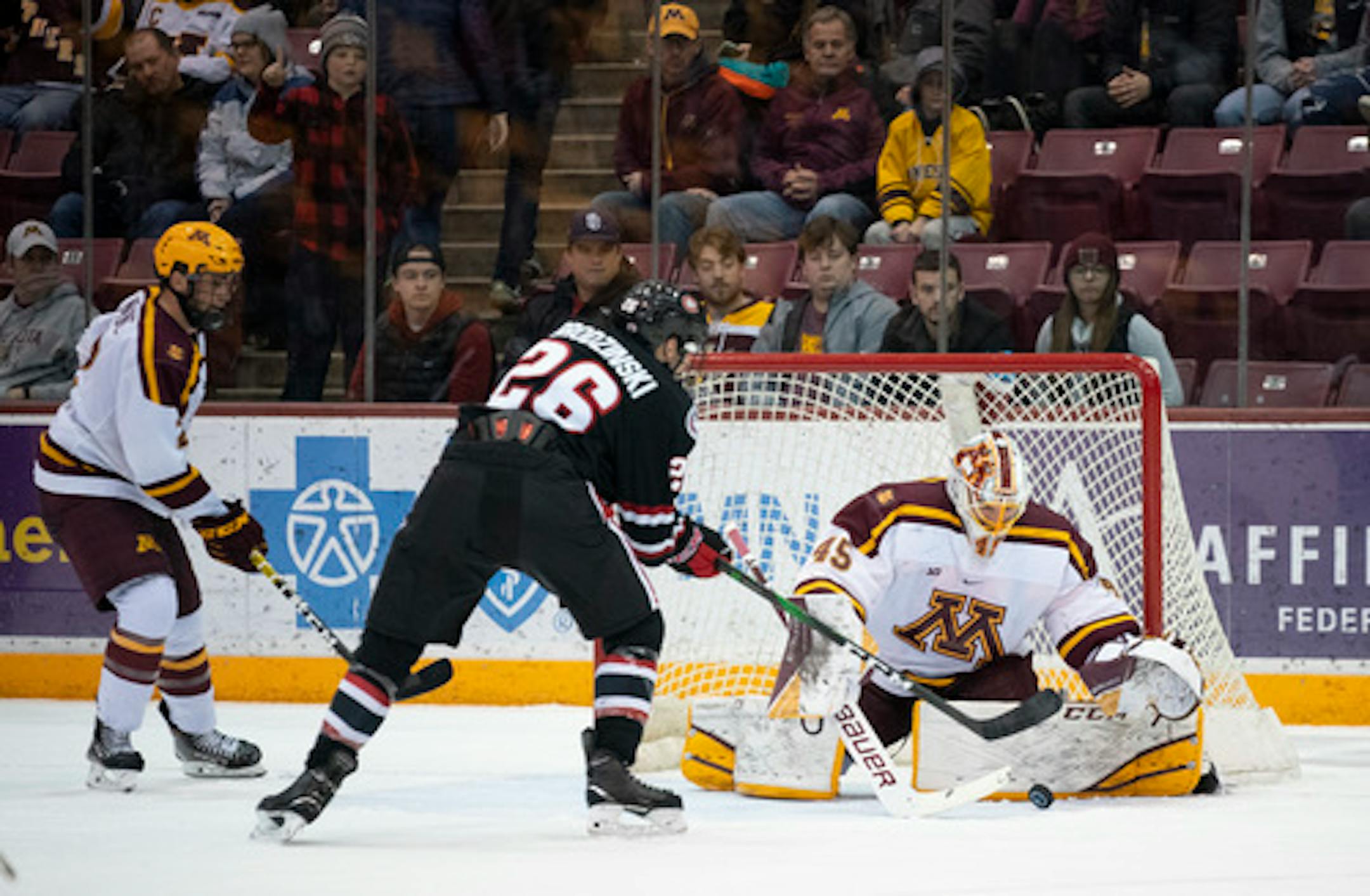 Gophers goalie Jack LaFontaine denied St. Cloud State's Easton Brodzinski during Minnesota's victory in the Mariucci Classic championship game.