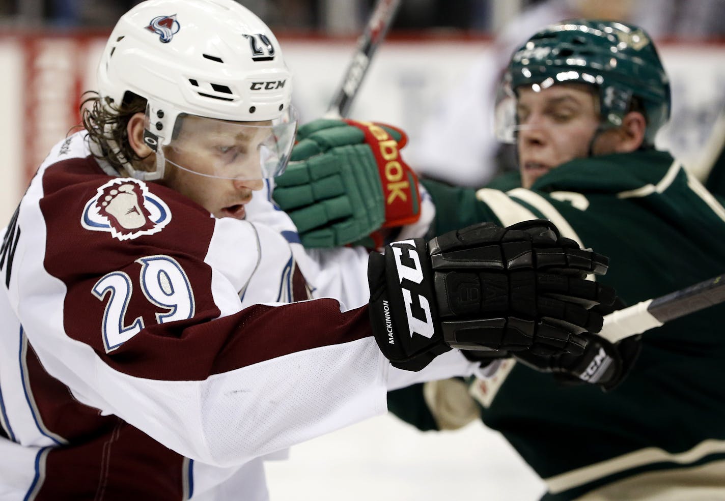 Nathan MacKinnon (29) was pressured by Erik Haula (56) in the second period. ] CARLOS GONZALEZ cgonzalez@startribune.com - April 21, 2014, St. Paul, Minn., Xcel Energy Center, NHL, Minnesota Wild vs. Colorado Avalanche, Stanley Cup Playoffs round 1, Game 3