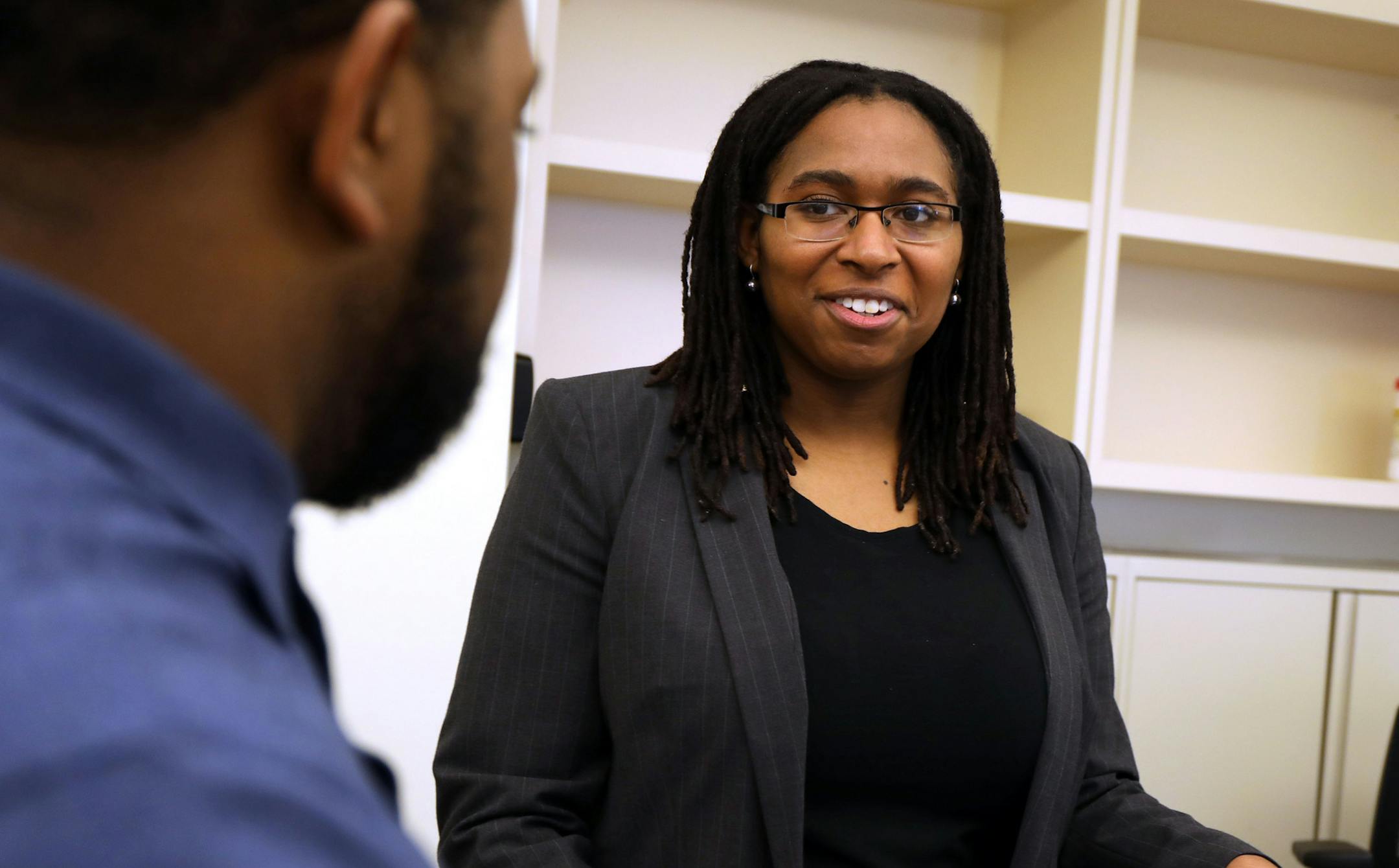 Apprentice, Kai Steward, right, works with IT support member Corey Smith in the Aon workplace solutions department on April 17, 2017 in Chicago. Aon's first class of 25 apprentices started in January. (Phil Velasquez/Chicago Tribune/TNS)