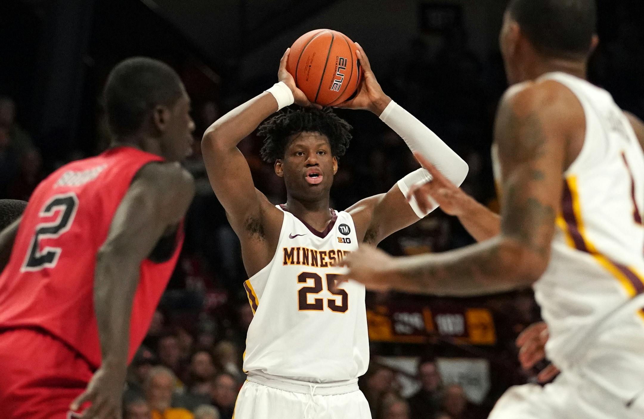 Minnesota Golden Gophers center Daniel Oturu (25) looked to pass the ball off to Arkansas State Red Wolves guard Kobe Wilson (1) as he raced to the basket in the second half. ] ANTHONY SOUFFLE ï anthony.souffle@startribune.com The Minnesota Golden Gophers played the Arkansas State Red Wolves in an NCAA men's basketball game Saturday, Dec. 8, 2018 at Williams Arena in Minneapolis.