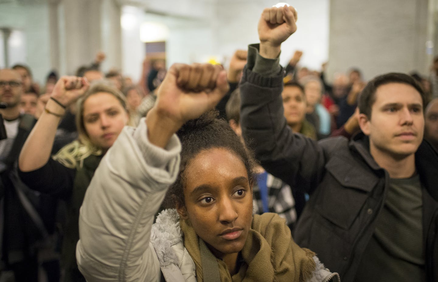 Activist Netsanet Negussie raised her hand in solidarity during Thursday night's protest at Minneapolis City Hall. ] (AARON LAVINSKY/STAR TRIBUNE) aaron.lavinsky@startribune.com Black Lives Matter held a protest outside Minneapolis City Hall in response to the Minneapolis Police Department's overnight removal of the 4th Precinct encampment on Thursday, Dec. 3, 2015.