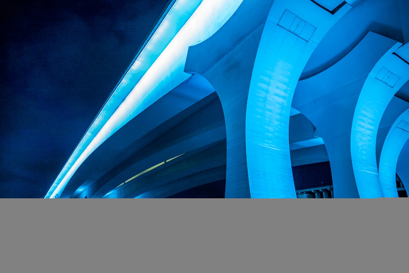 The Interstate 35W Bridge in Minneapolis glowed light blue Thursday night, April 9, to honor healthcare providers and essential workers.