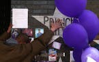 A mourner and fan touched the star for Prince on a wall at First Avenue. Hundreds of fans continued to lay flowers, mementos and take photographs at t