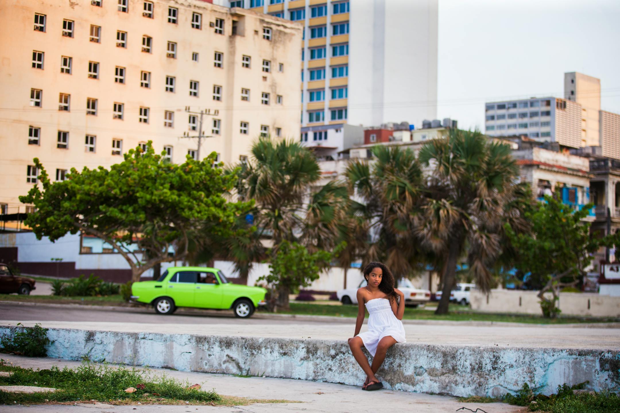 A girl sits in La Piragua park in Havana, Cuba on Wednesday, May 13, 2015.