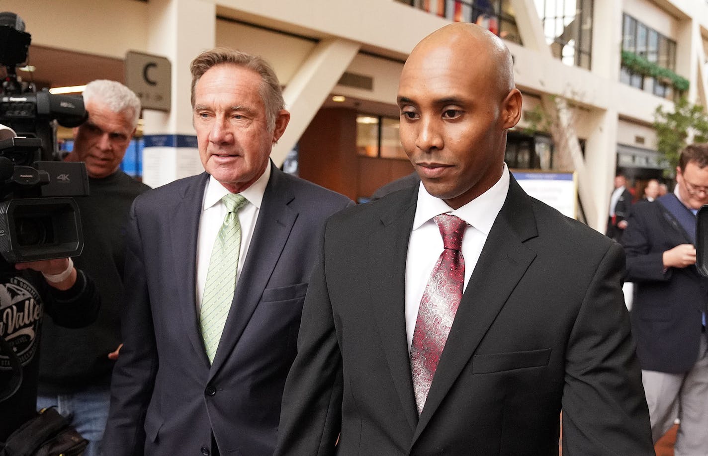 Mohamed Noor, accompanied by his legal team, Peter Wold, and Tom Plunkett left following a probable cause hearing for the ex-Minneapolis cop Thursday at the Hennepin County Government Center. ] ANTHONY SOUFFLE &#xef; anthony.souffle@startribune.com Mohamed Noor, accompanied by his legal team, Peter Wold, and Tom Plunkett arrived to argue pretrial motions at a probable cause hearing for the ex-Minneapolis cop Thursday, Sept. 27, 2018 at the Hennepin County Government Center in Minneapolis. The he