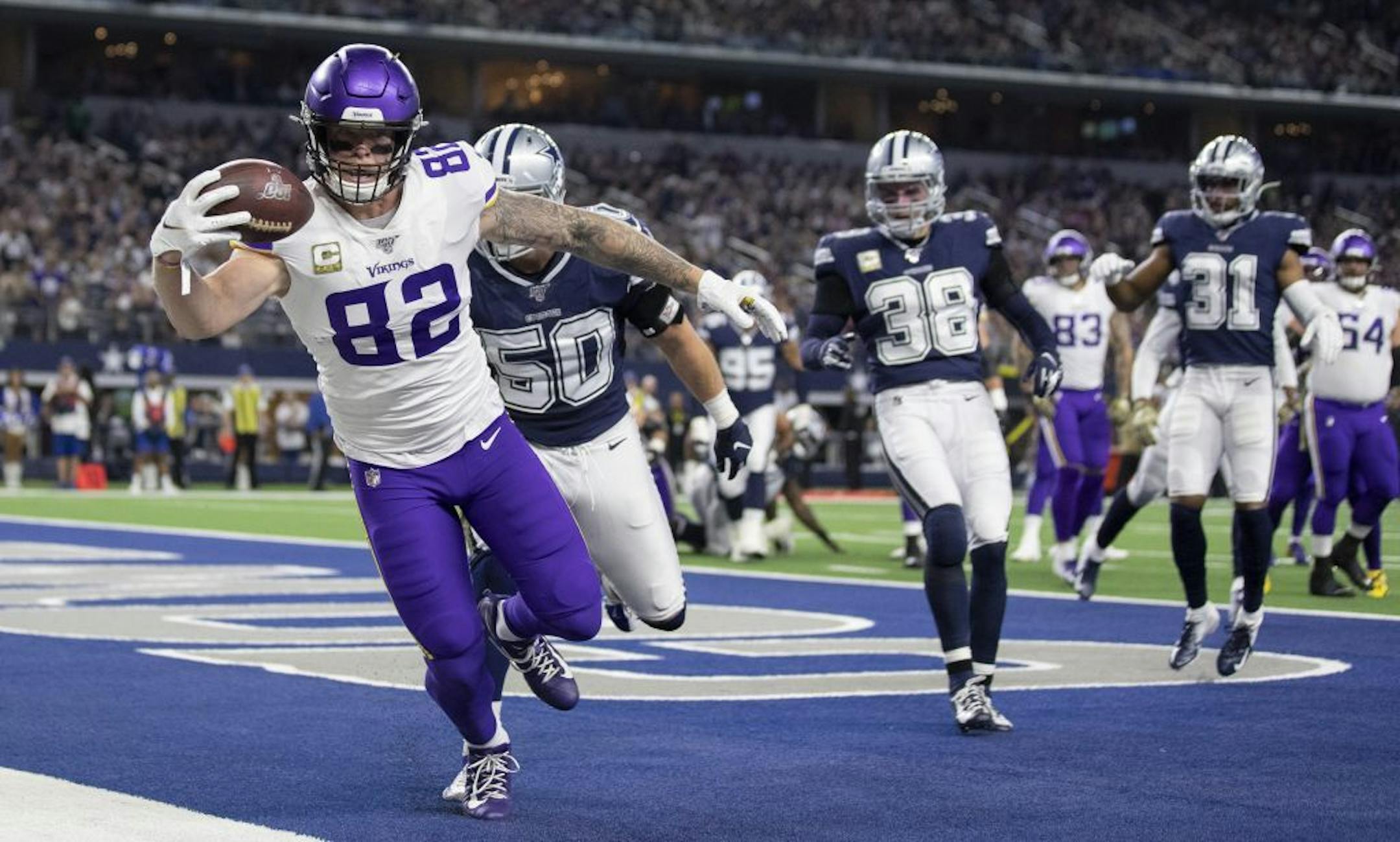 Minnesota Vikings tight end Kyle Rudolph (82) caught a touchdown pass over Dallas Cowboys outside linebacker Sean Lee (50) in the first quarter AT&T Stadium.