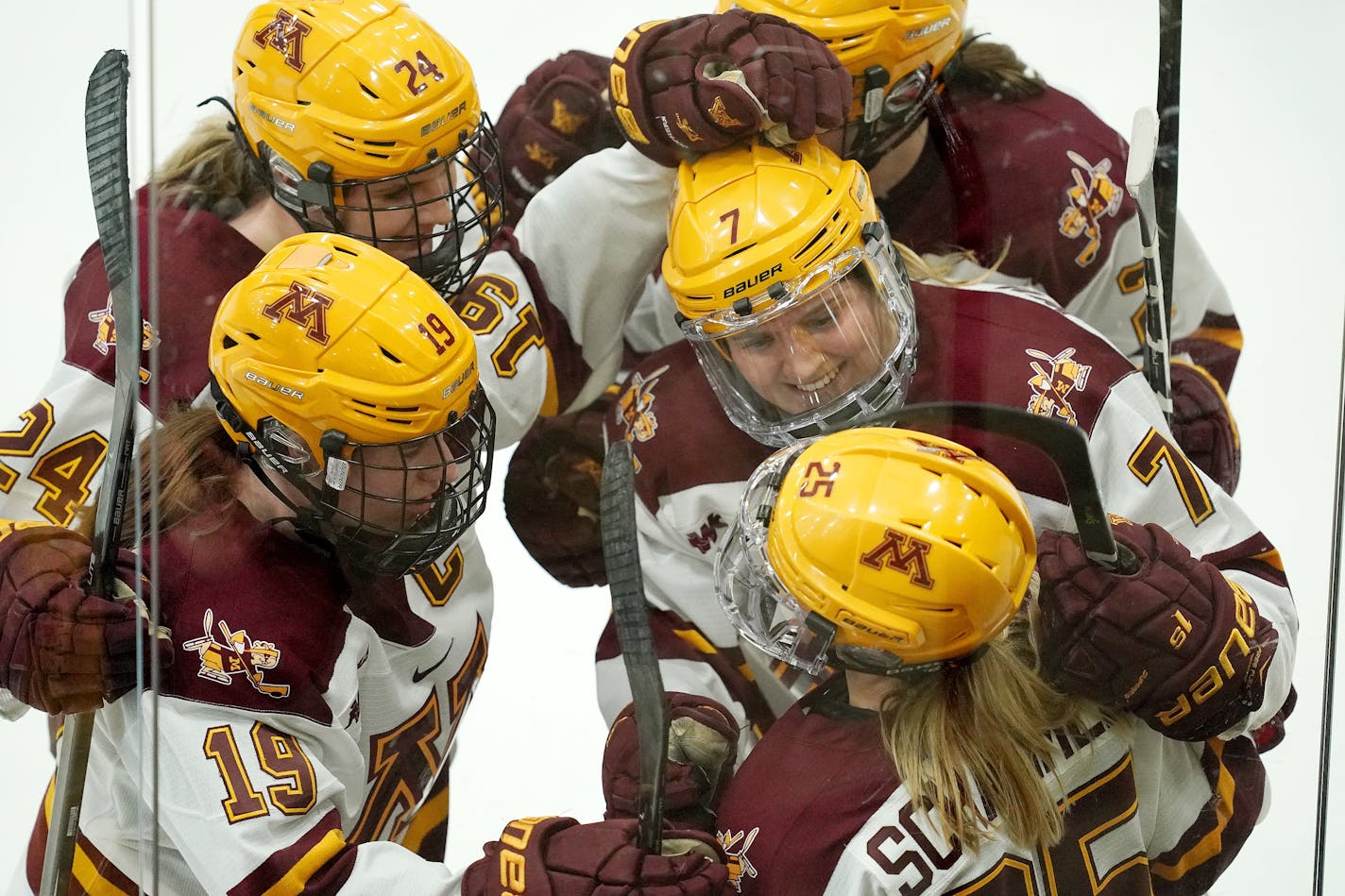 Gophers forward Nicole Schammel (25) was congratulated by teammates after scoring in the third period last weekend against Princeton.