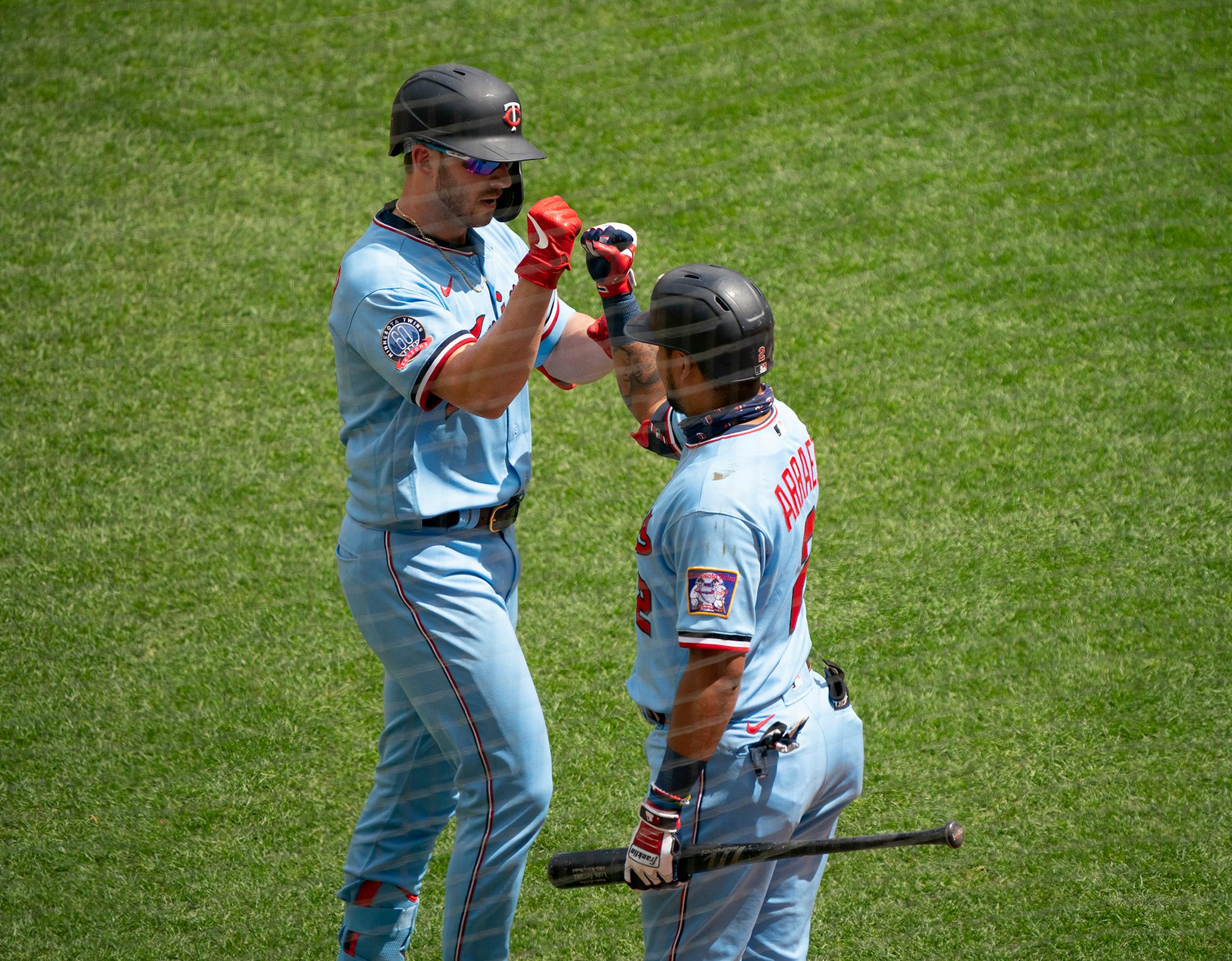 Minnesota Twins catcher Mitch Garver (8) celebrated with second baseman Luis Arraez (2) after he hit a solo homer off Cleveland Indians starting pitcher Aaron Civale in the second inning.