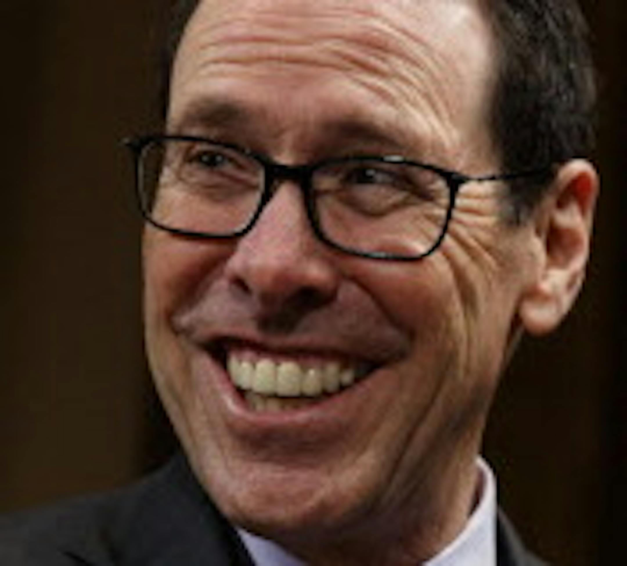 AT&T Chairman and CEO Randall Stephenson smiles on Capitol Hill in Washington, Wednesday, Dec. 7, 2016, prior to testifying before a Senate Judiciary subcommittee hearing on the proposed merger between AT&T and Time Warner. (AP Photo/Evan Vucci)