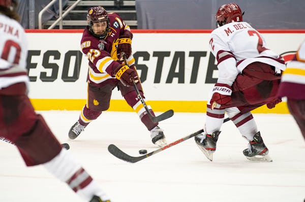 UMD forward Nick Swaney (23) took a shot in the third period. ]