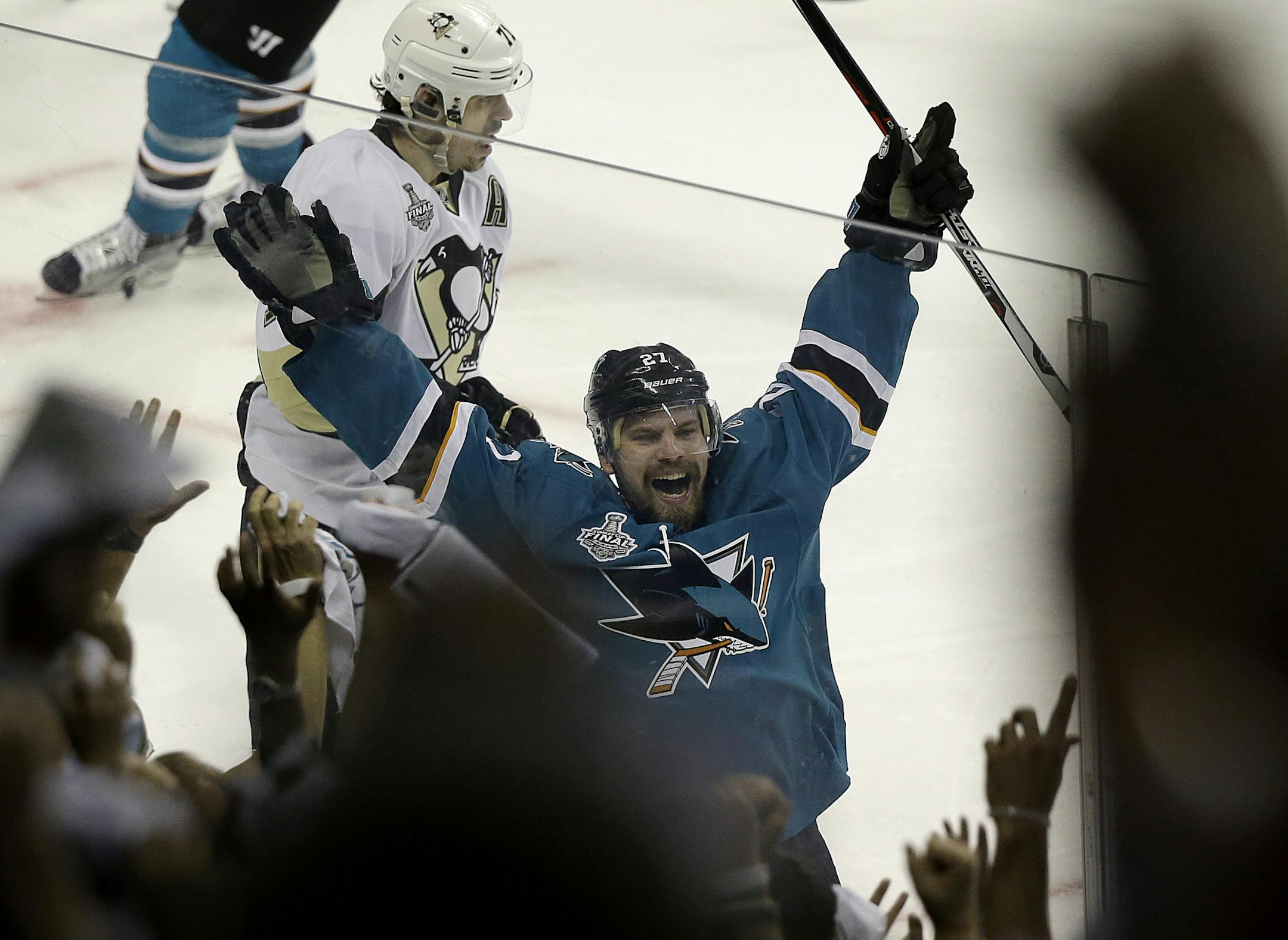 San Jose Sharks right wing Joonas Donskoi (27), from Finland, celebrates after scoring the winning goal against the Pittsburgh Penguins during overtime of Game 3 of the NHL hockey Stanley Cup Finals in San Jose, Calif., Saturday, June 4, 2016. The Sharks won 3-2. (AP Photo/Eric Risberg)