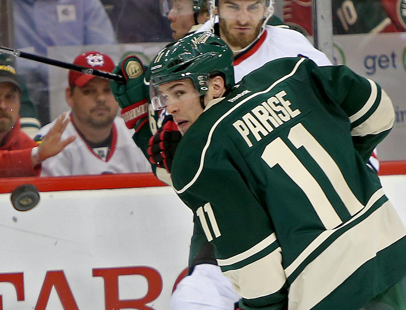 Minnesota Wild left wing Zach Parise (11) chased the puck in Blackhawks territory in the second period as the Minnesota Wild took on the Chicago Blackhawks in game 3 of the series the the Stanley Cup Playoffs, Tuesday, May 6, 2014 at the Xcel Energy Center in St. Paul, MN. ] (ELIZABETH FLORES/STAR TRIBUNE) ELIZABETH FLORES &#x2022; eflores@startribune.com