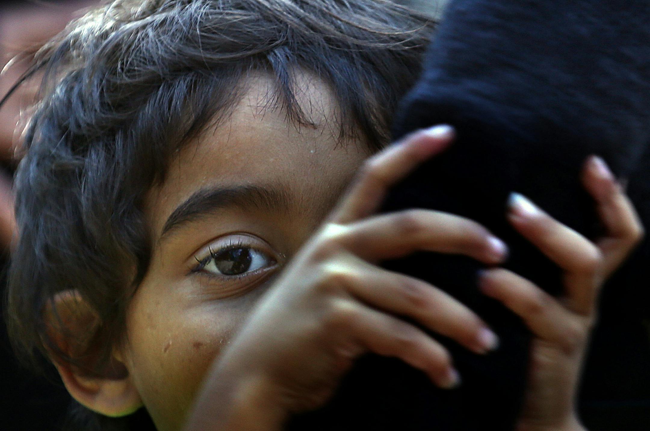 Crisis reenactors: Volunteers, including 4-year-old Jacob Dalton and his mom, stepped up to portray refugees for a simulation class. They reproduced a humanitarian crises so students considering volunteer work could get hands-on experience.