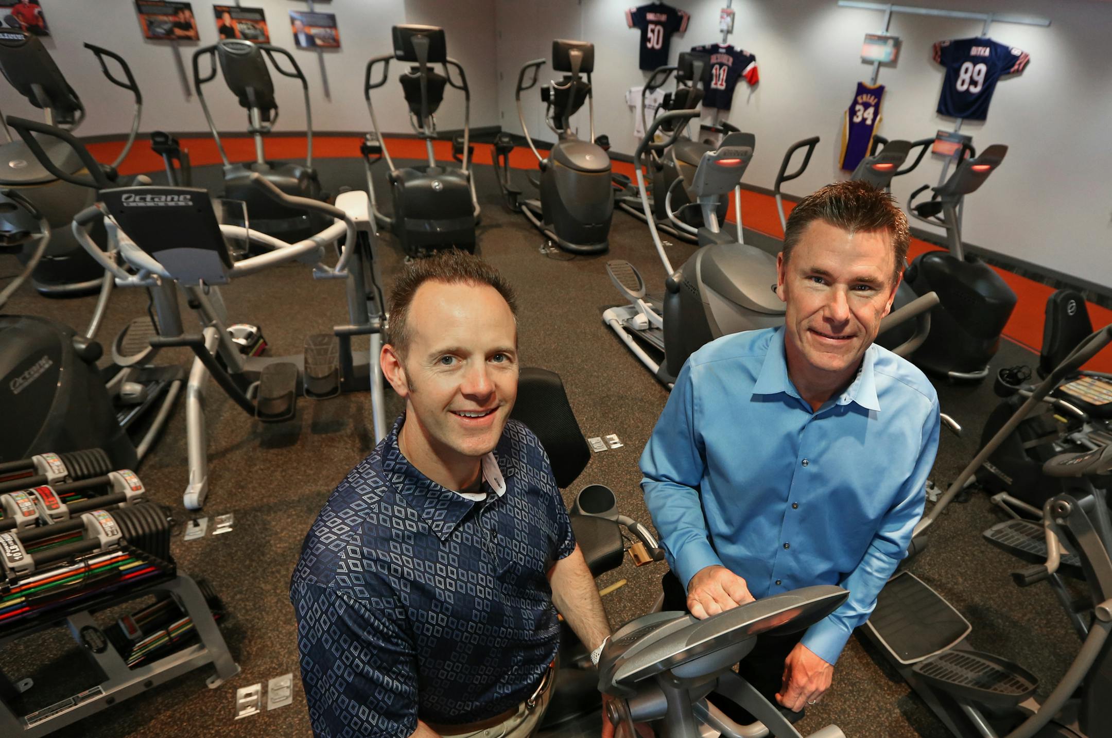 (left to right) Octane Fitness founders Tim Porth and Dennis Lee at the Octane company headquarters showroom, photographed on 5/27/14.] Bruce Bisping/Star Tribune bbisping@startribune.com Tim Porth, Dennis Lee/source.