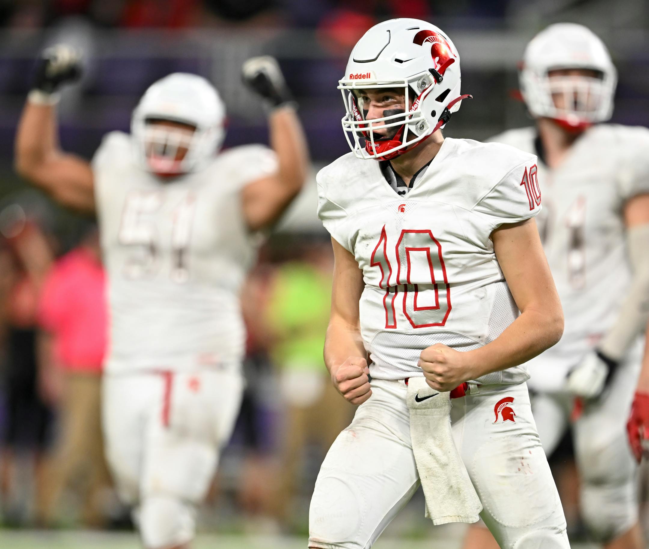 Simley quartberback Caden Renslow (10) celebrates a first down that would give his team control of the clock, and a win, late in the fourth quarter.