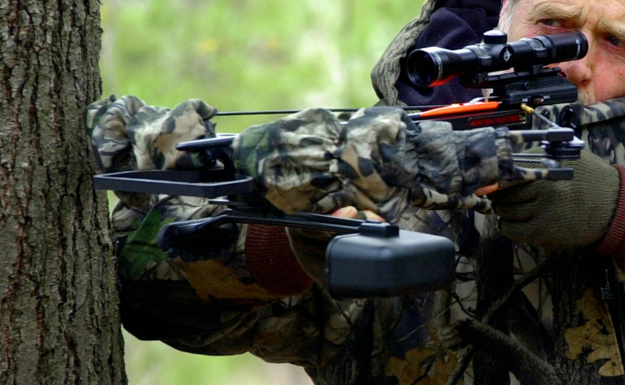 ** ADVANCE FOR WEEKEND EDITIONS MAY 14-15 ** Bill Smith, of Mt Vernon, Maine, aims his crossbow while practicing at his home Monday, May 9, 2005. A bill allowing crossbow hunting during the deer firearm season will likely pass in the Legislature. Maine would join 17 other states that also allow crossbow hunting during firearms season. (AP Photo/Pat Wellenbach) ORG XMIT: MEPW101