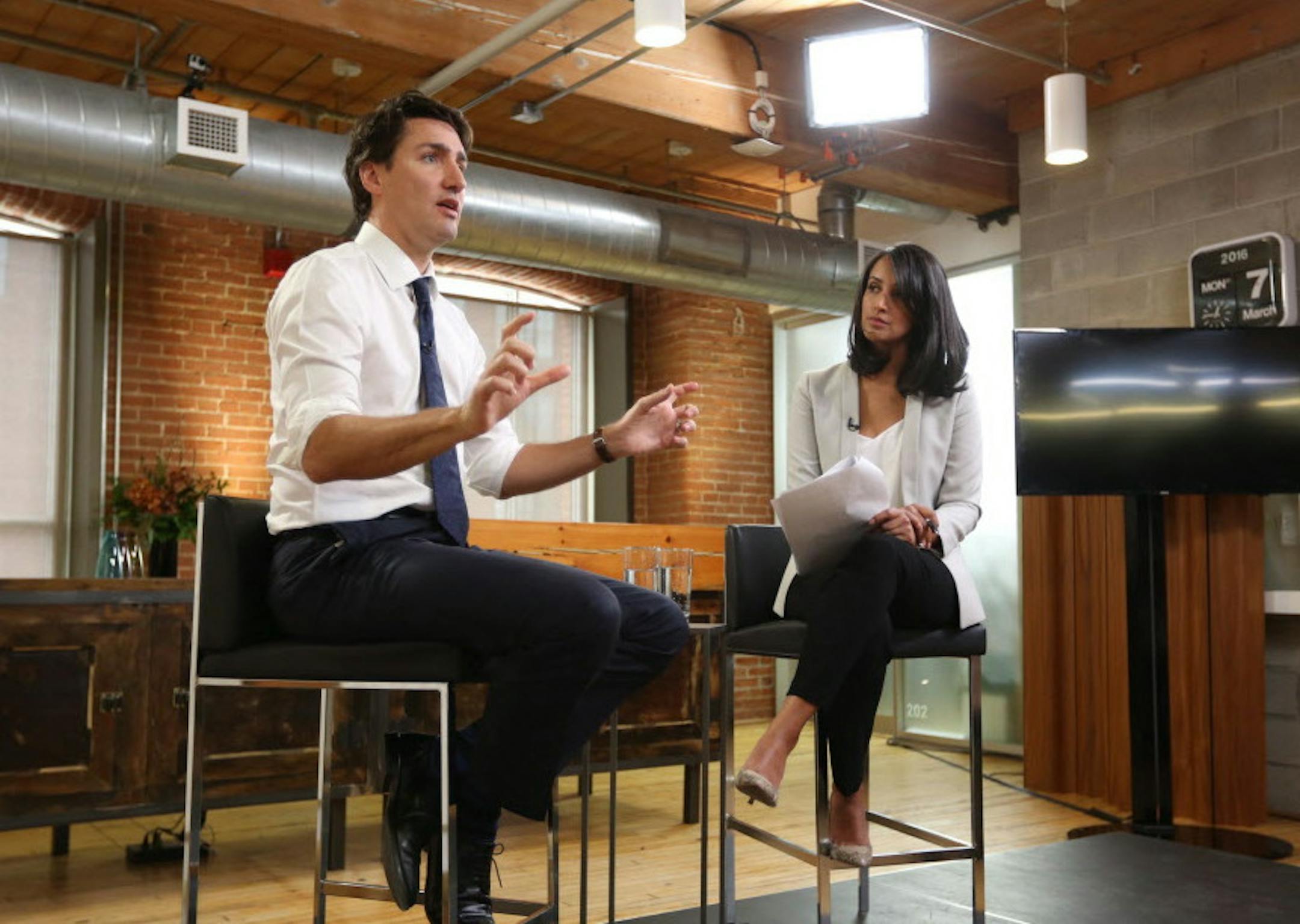 Canada's Prime Minister Justin Trudeau, left, speaks at a global town hall hosted by The Huffington Post Canada in Toronto on Monday, March 7, 2016. Trudeau answered questions on foreign policy from readers, students and Huffington Post's international editions. The event was moderated by HuffPost Canada's Ottawa bureau chief, Althia Raj, and livestreamed on The Huffington Post Canada and Facebook. (Tim Fraser/The Canadian Press via AP, Pool) MANDATORY CREDIT