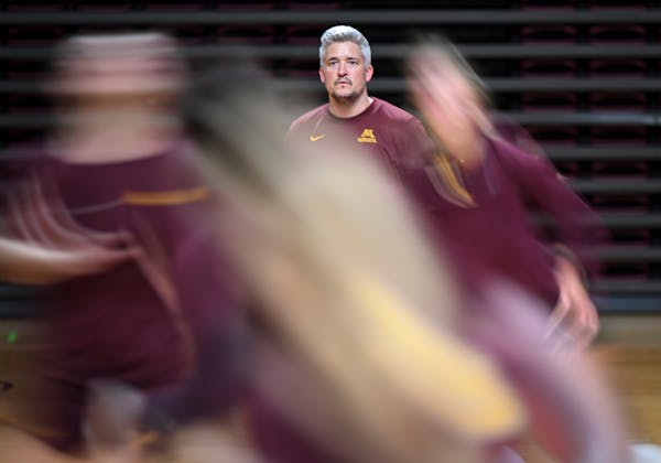 University of Minnesota volleyball head coach Keegan Cook watches over the team during practice Monday, Aug. 14, 2023 at the Maturi Pavilion in Minnea