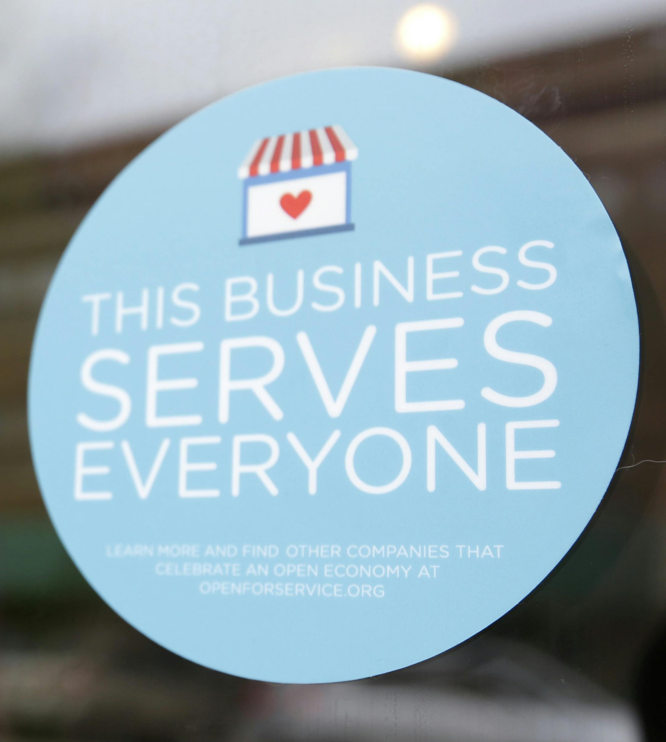 A window sticker on a downtown Indianapolis business, Wednesday, March 25, 2015, shows its objection to the Religious Freedom bill passed by the Indiana legislature. Organizers of a major gamers' convention and a large church gathering say they're considering moving events from Indianapolis over a bill that critics say could legalize discrimination against gays. (AP Photo/Michael Conroy)