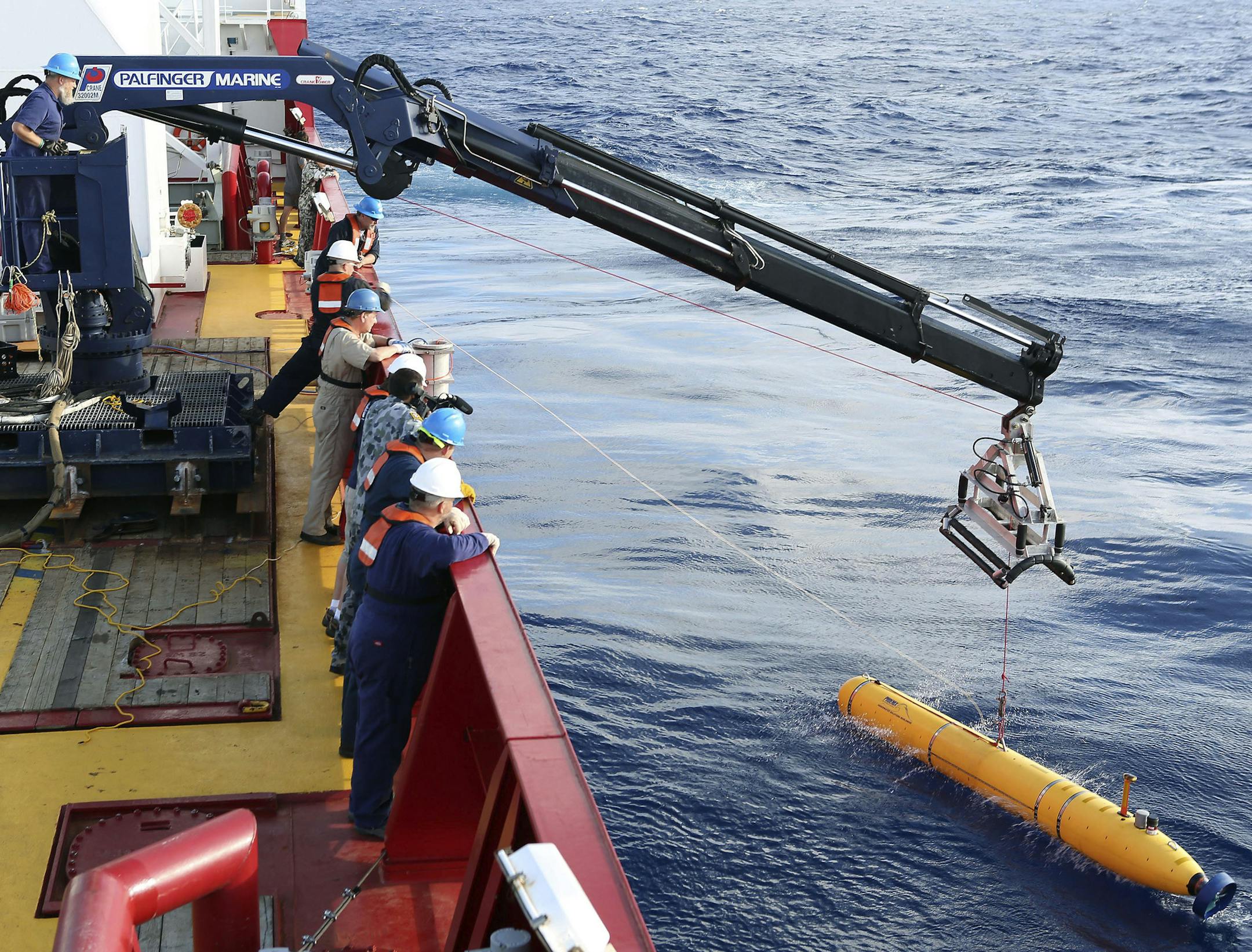 In this Monday, April 14, 2014, photo provided by the Australian Defense Force an autonomous underwater vehicle is deployed from ADV Ocean Shield in the search of the missing Malaysia Airlines Flight 370 in the southern Indian Ocean. The search area for the missing Malaysian jet has proved too deep for the robotic submarine which was hauled back to the surface of the Indian Ocean less than half way through its first seabed hunt for wreckage and the all-important black boxes, authorities said on