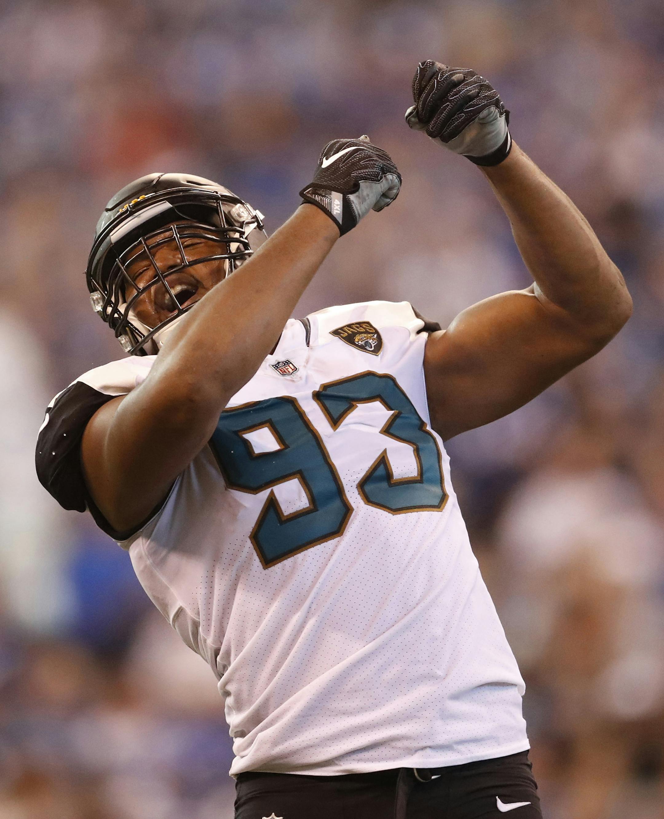 FILE- This Oct. 22, 2017, file photo shows Jacksonville Jaguars defensive end Calais Campbell (93) celebrating a sack against the Indianapolis Colts during the second half of an NFL football game in Indianapolis. Campbell has two things he wants to bring back from Arizona: An eighth victory and Larry Fitzgeraldís No. 11 jersey. One is much more important to him than the other. Campbell will return to the place where he spent the previous nine seasons when the Jacksonville Jaguars (7-3) play
