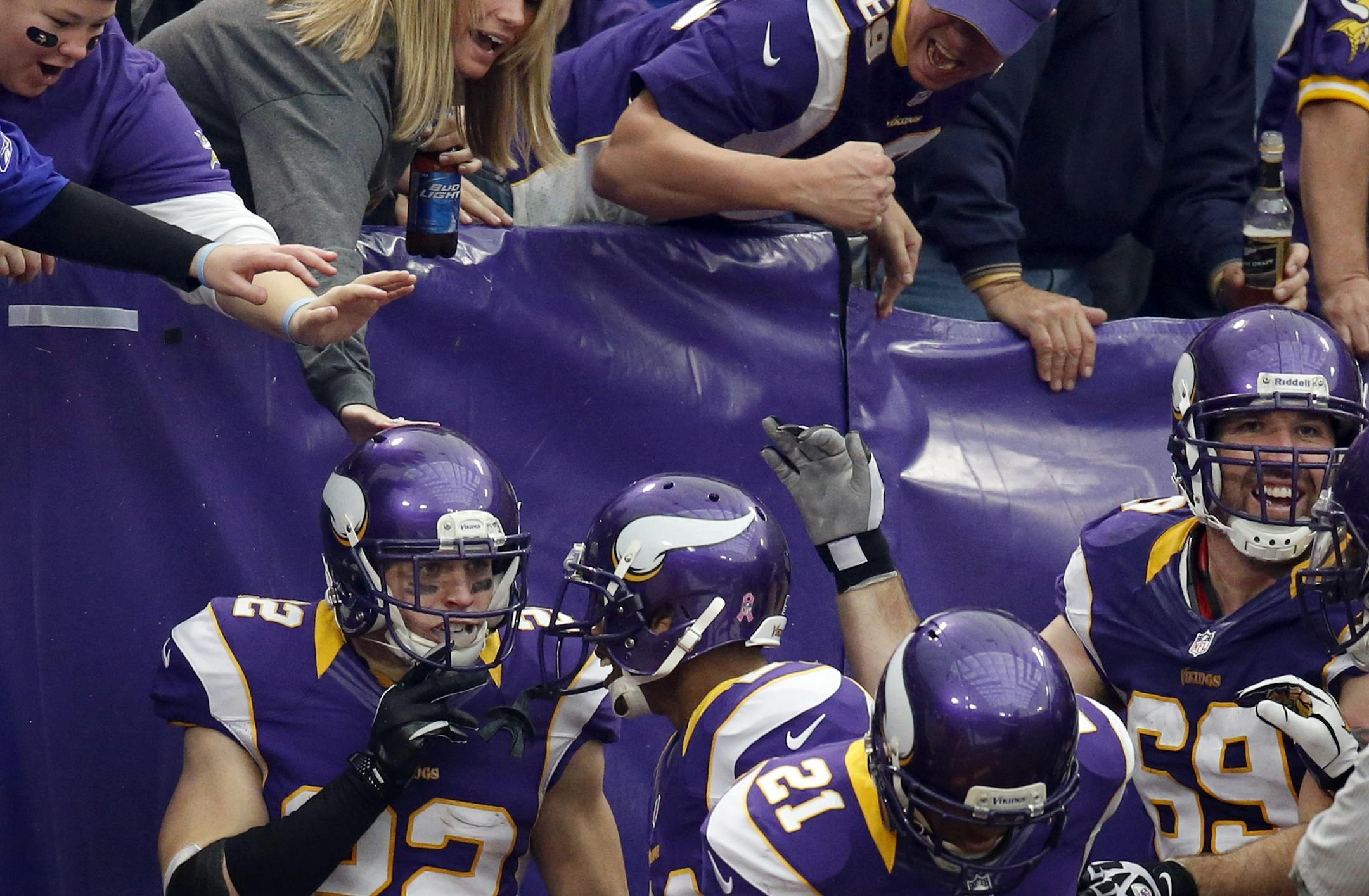 Minnesota Vikings Harrison Smith (22) celebrated with teammates after intercepting a pass and returning it for a touchdown in the third quarter.