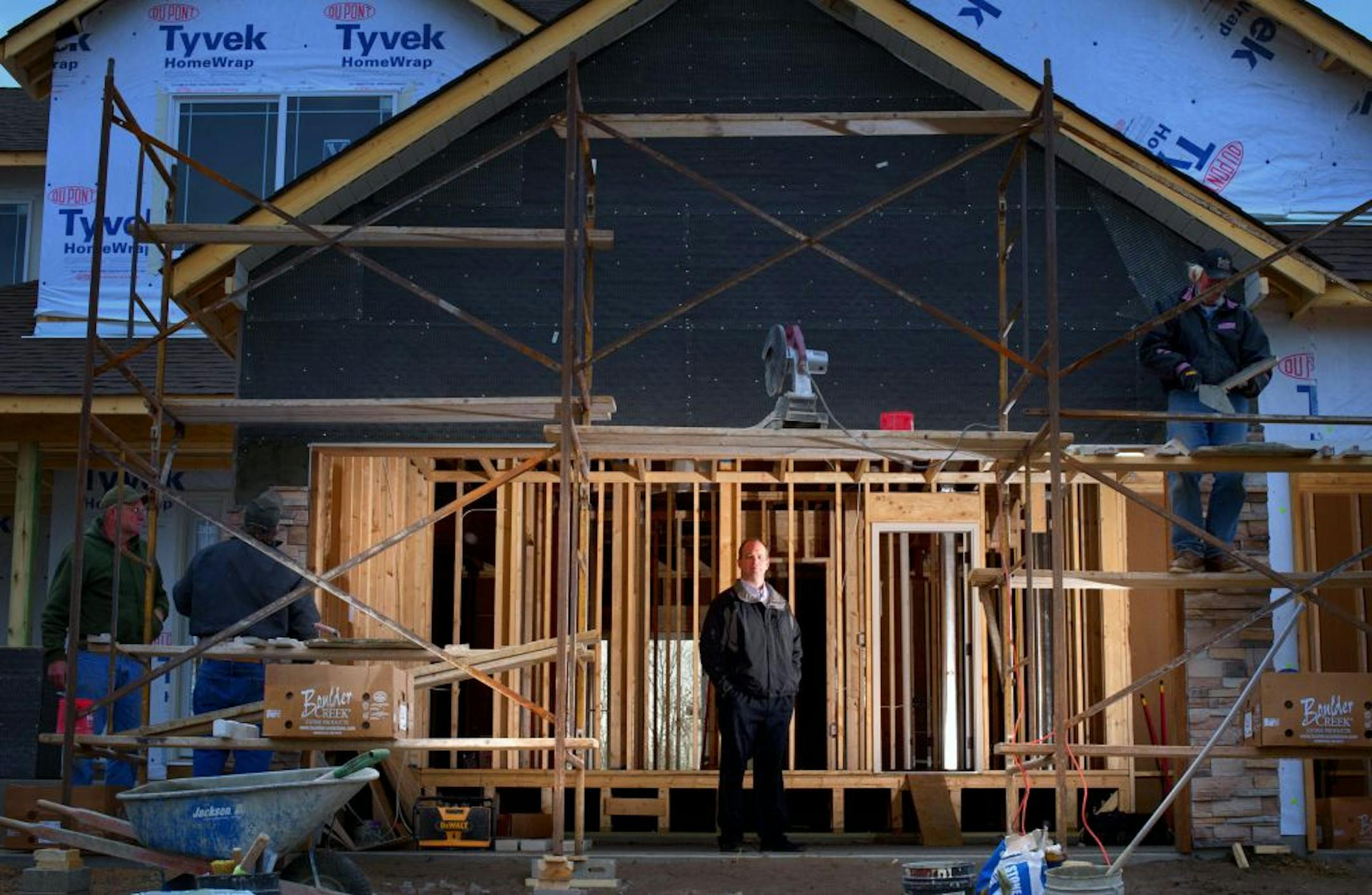 Jason Semler stood in the garage of a house his company is building in Blaine. Builders face increasing pressure to keep costs down since there are so many existing homes already on the market.