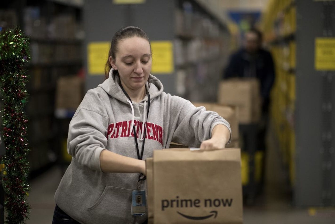 Camille Rodden an associated at Amazon Prime Now hub selected items for customers Thursday December 21, 2017 in Minneapolis, MN.