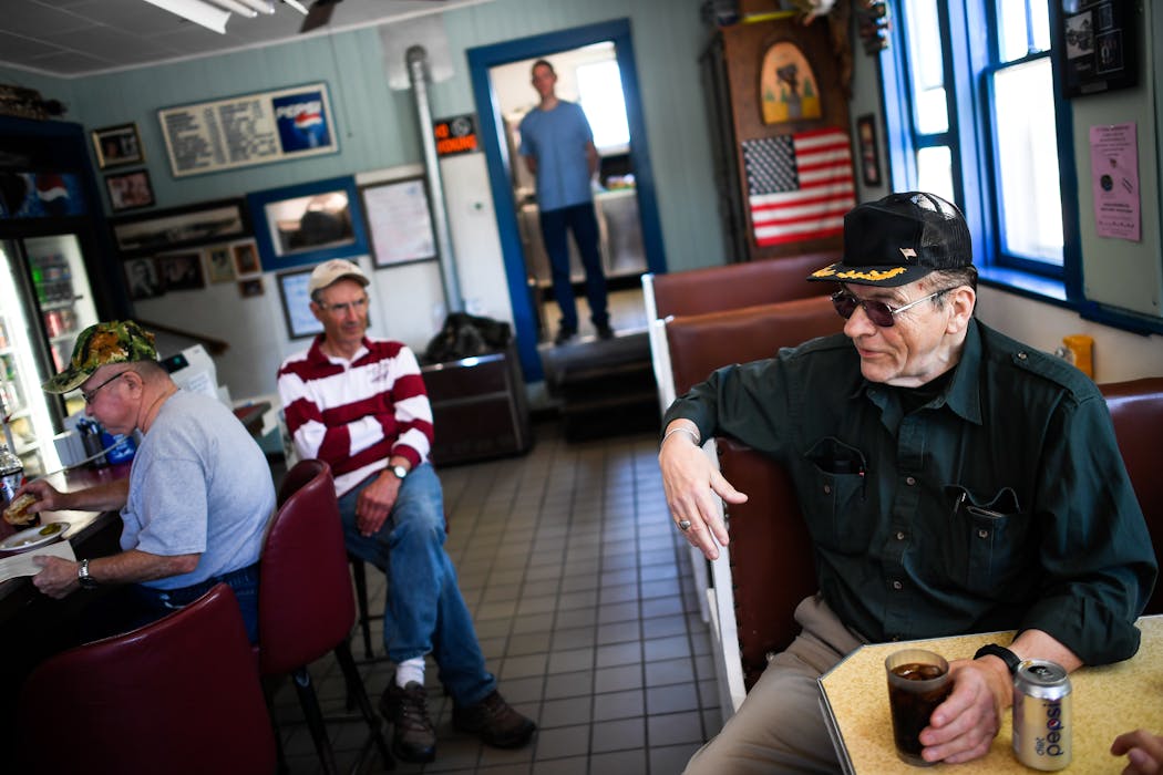 Kenneth Mosser, right, of Wells, Minn., talked politics at the Rapidan Dam Store's cafe in 2017. 